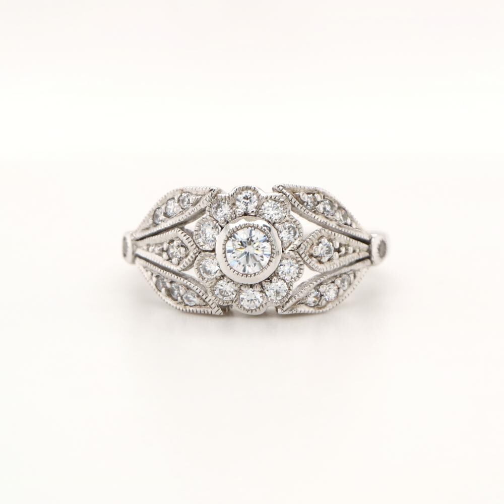 Flower and Petal ring with diamonds in white gold