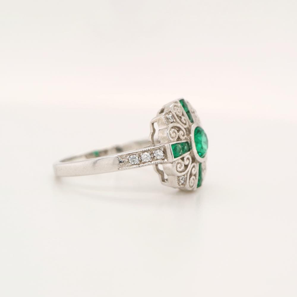 Filigree Emerald and Diamond ring in White Gold