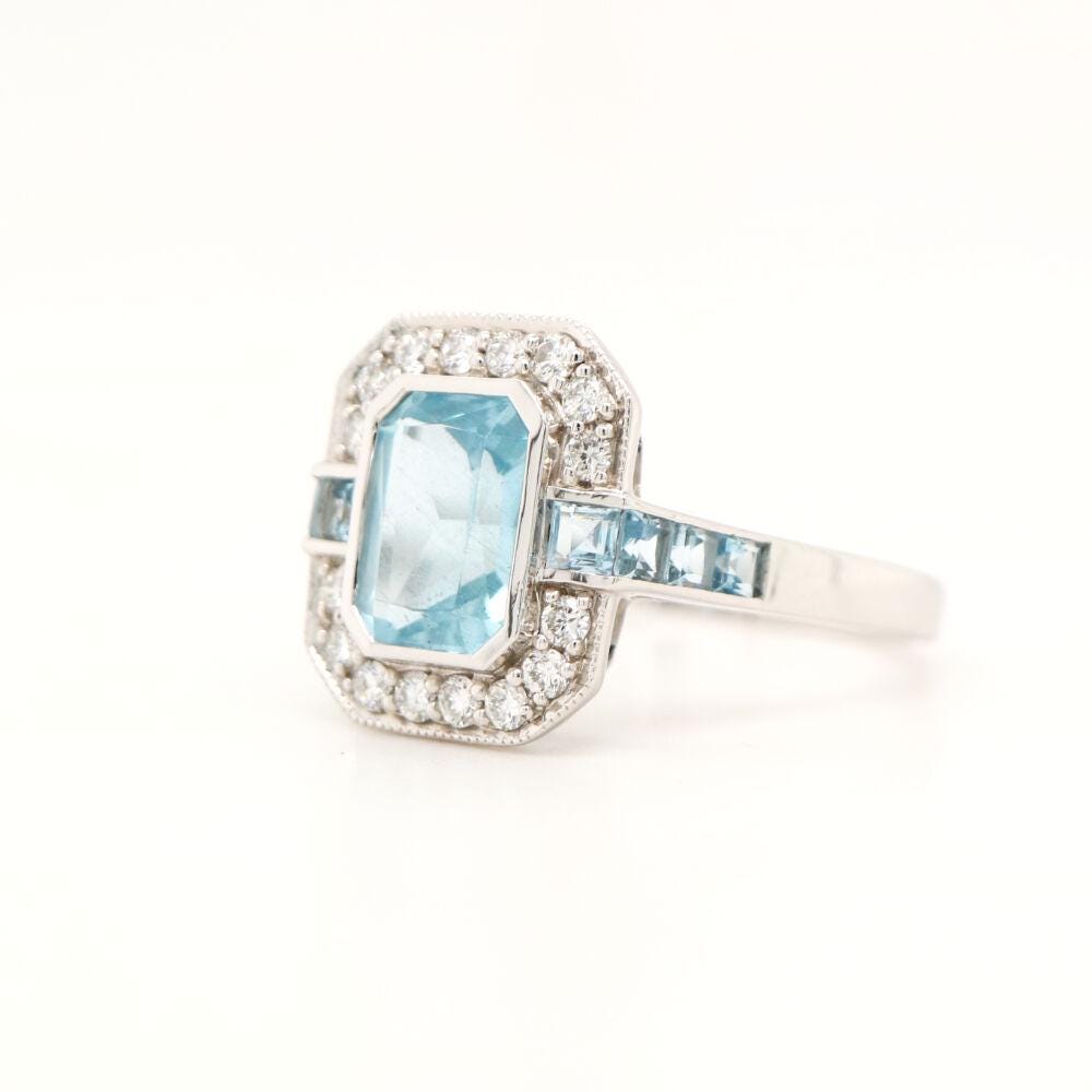 Aquamarine ring in Gold with Diamond Halo