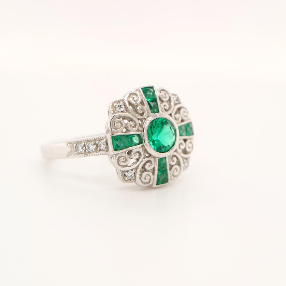 Filigree Emerald and Diamond ring in White Gold