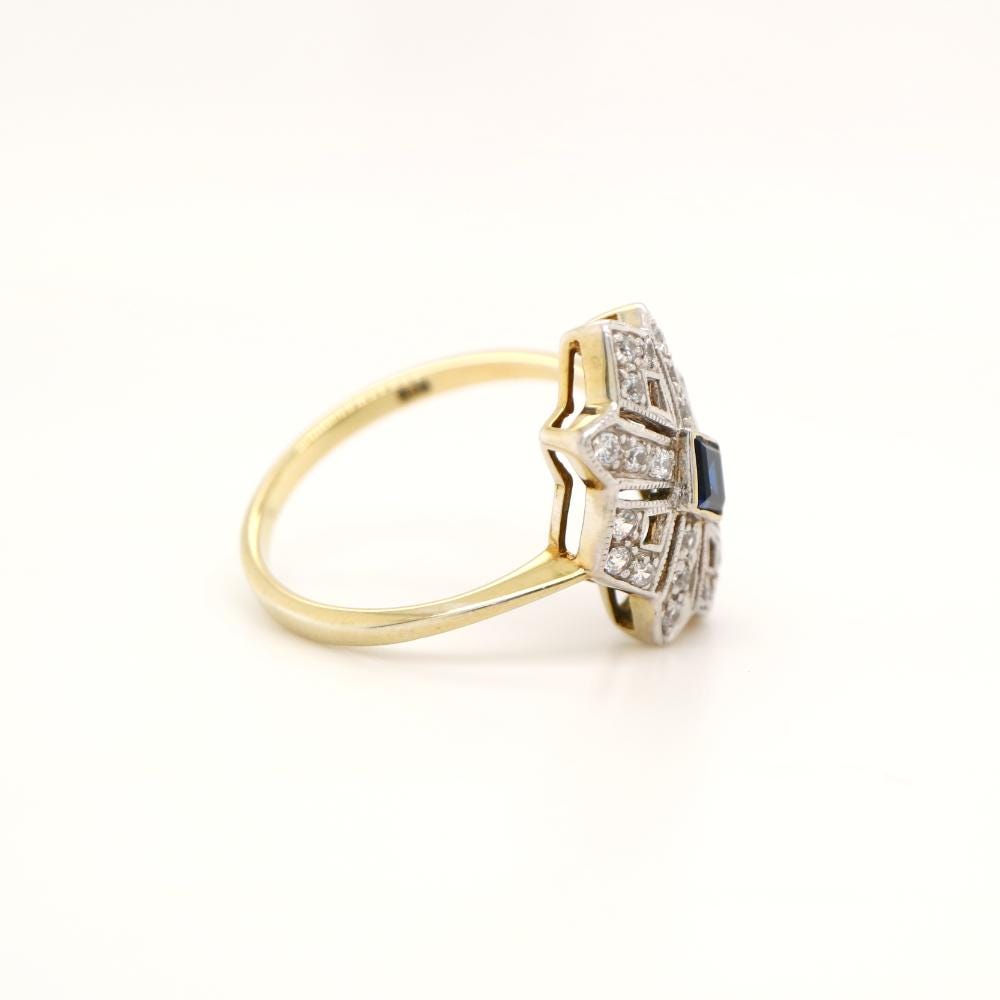 Starburst Shield ring with Sapphire centre and Diamond in twin Gold