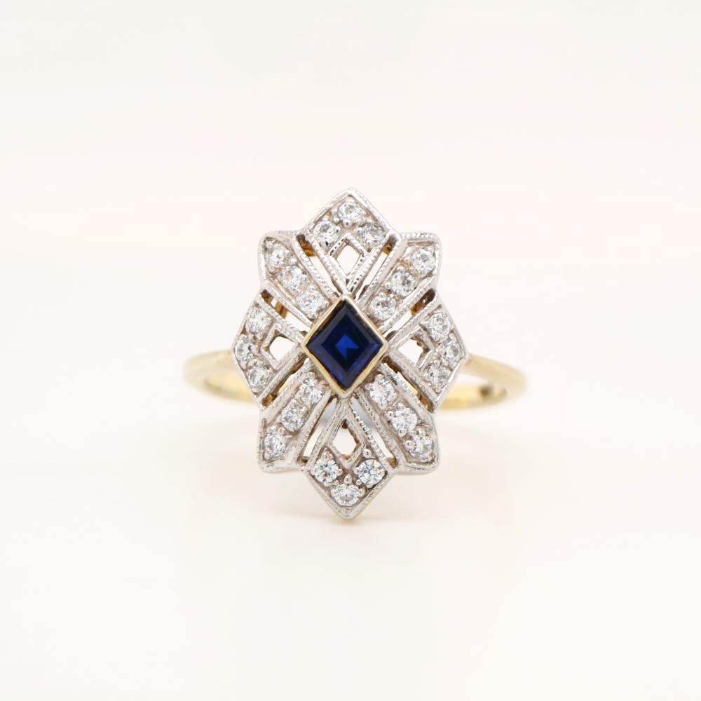 Starburst Shield ring with Sapphire centre and Diamond in twin Gold