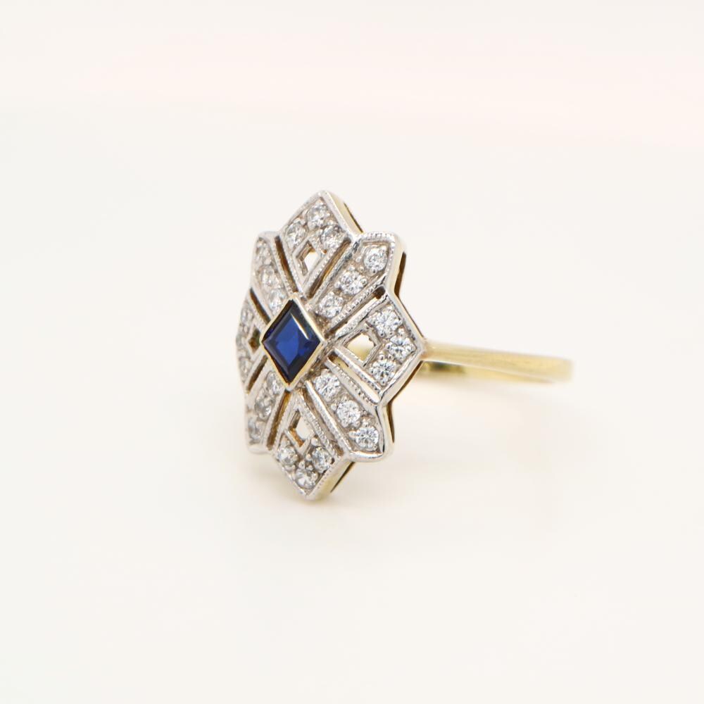Starburst Shield ring with Sapphire centre and Diamond in twin Gold