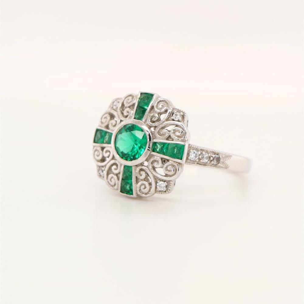 Filigree Emerald and Diamond ring in White Gold