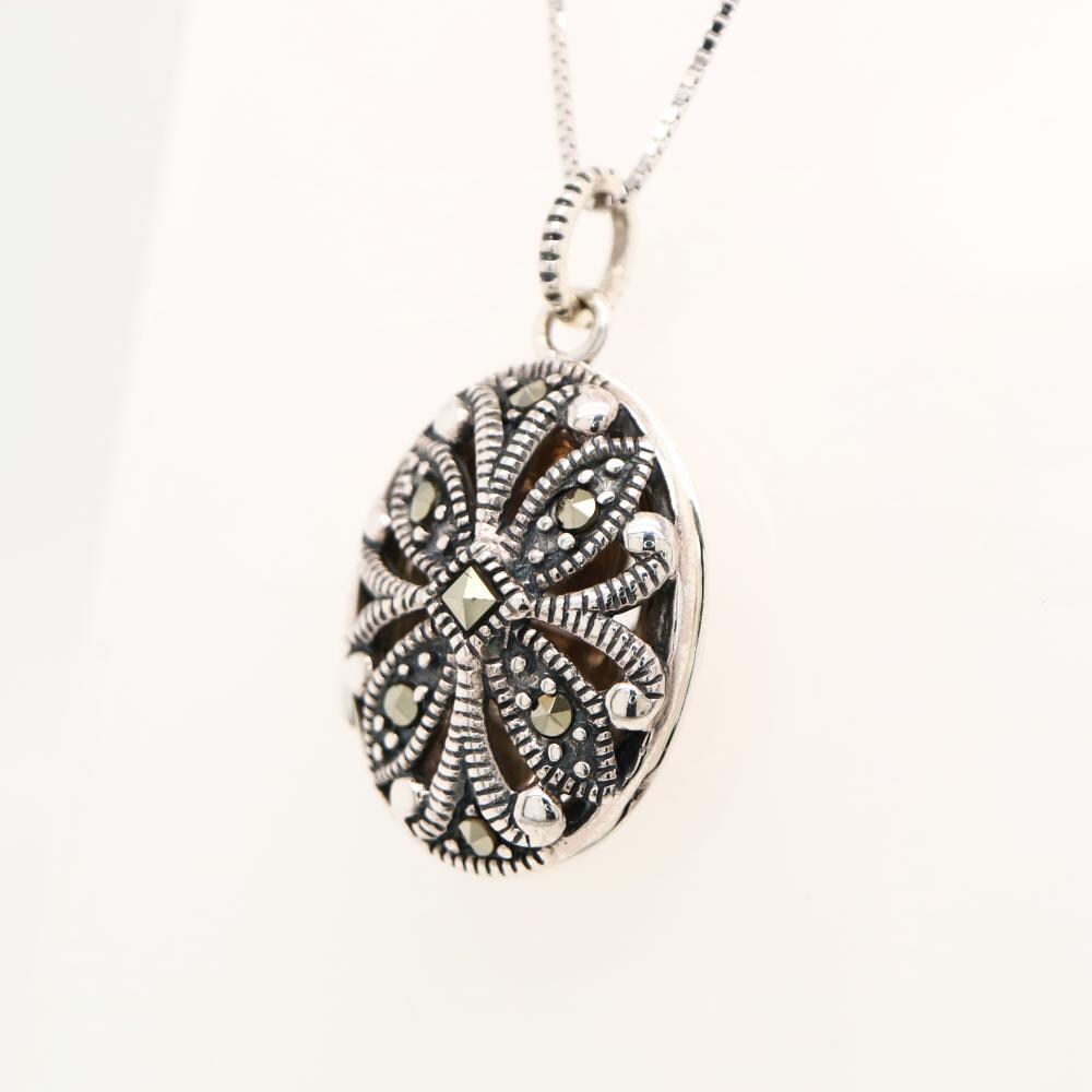 Flower locket in sterling silver with marcasite