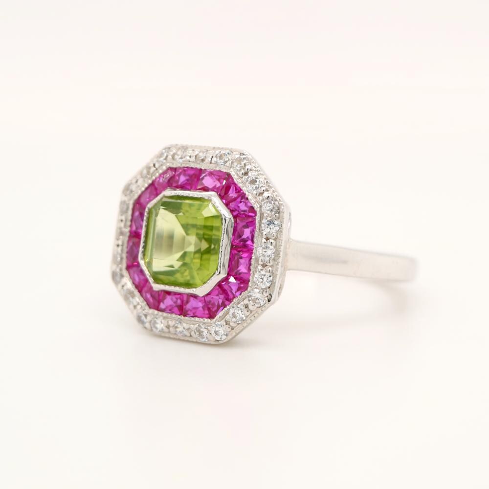 Peridot Target Ring with Ruby and Diamond Halo in White Gold