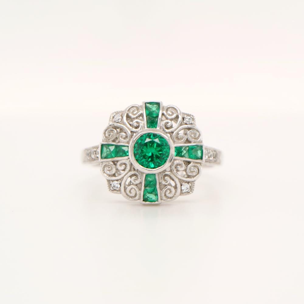 Filigree Emerald and Diamond ring in White Gold