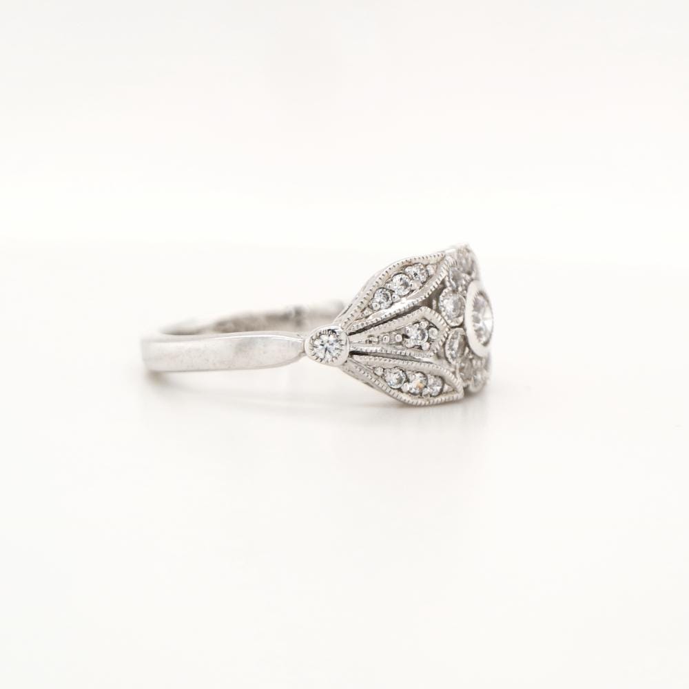 Flower and Petal ring with diamonds in white gold