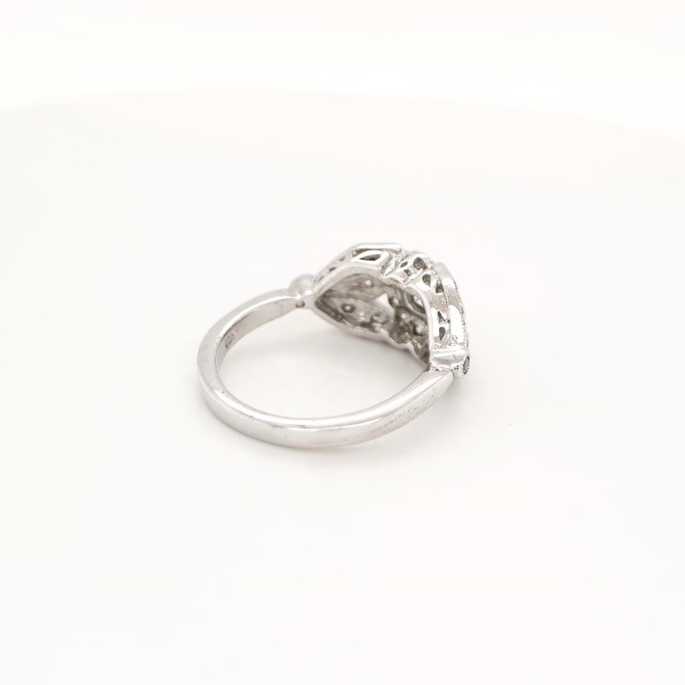 Flower and Petal ring with diamonds in white gold