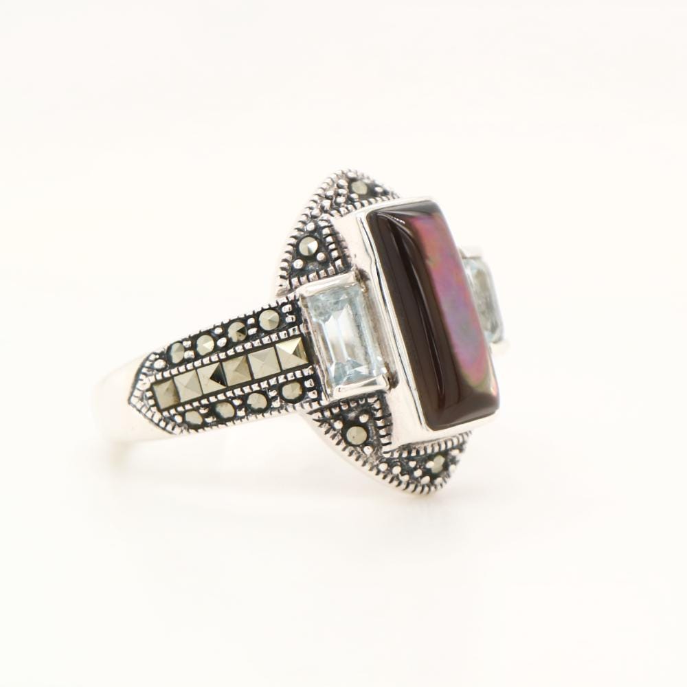 Silver lipped oyster shell and Pale Blue topaz ring with marcasite and Sterling Silver.
