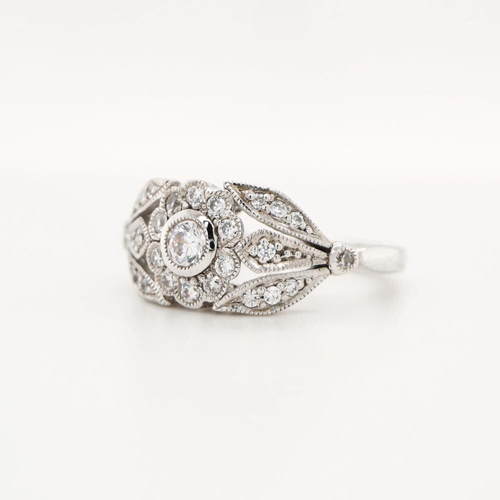 Flower and Petal ring with diamonds in white gold
