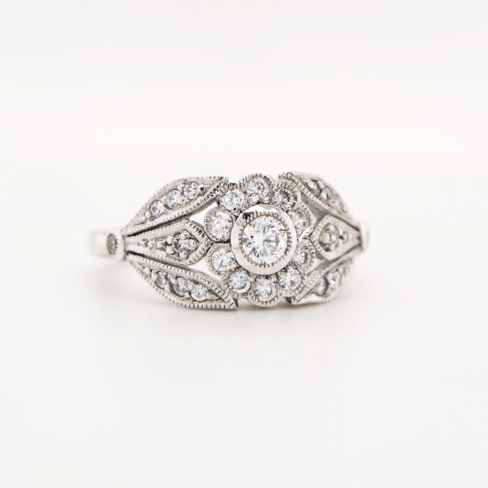 Flower and Petal ring with diamonds in white gold