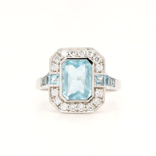 Aquamarine ring in Gold with Diamond Halo