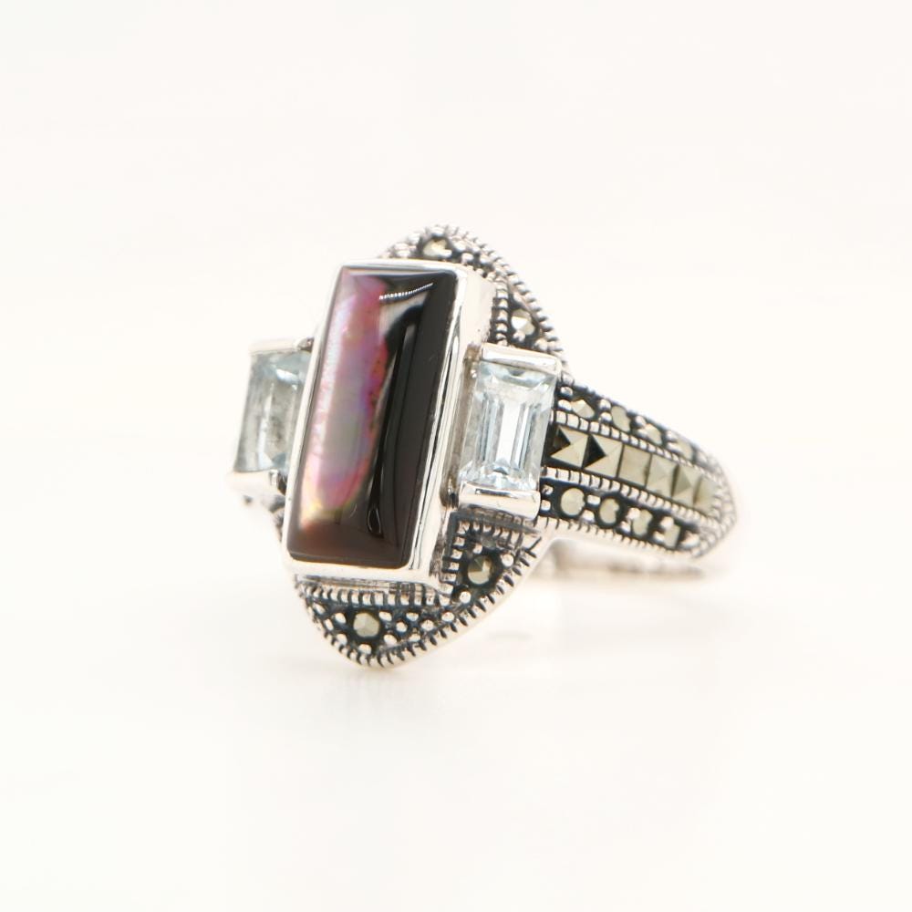 Silver lipped oyster shell and Pale Blue topaz ring with marcasite and Sterling Silver.