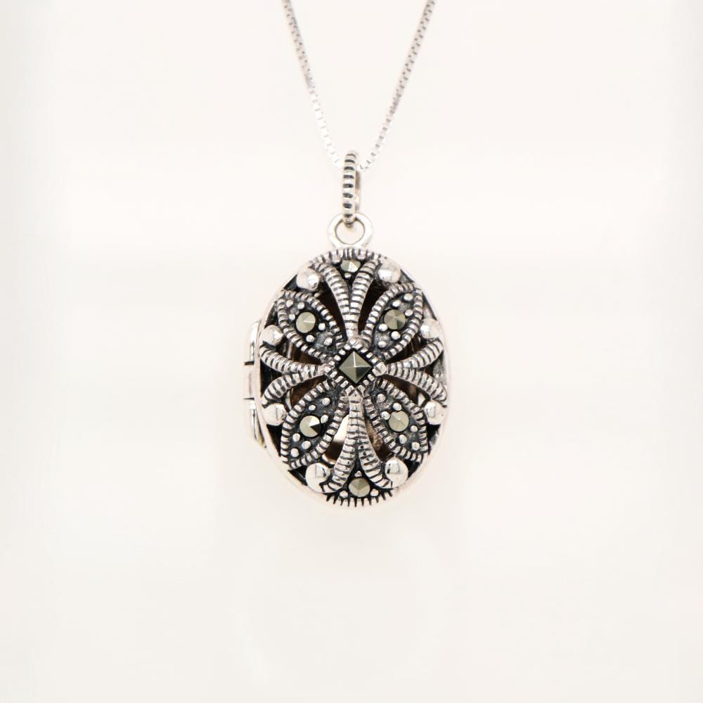 Flower locket in sterling silver with marcasite