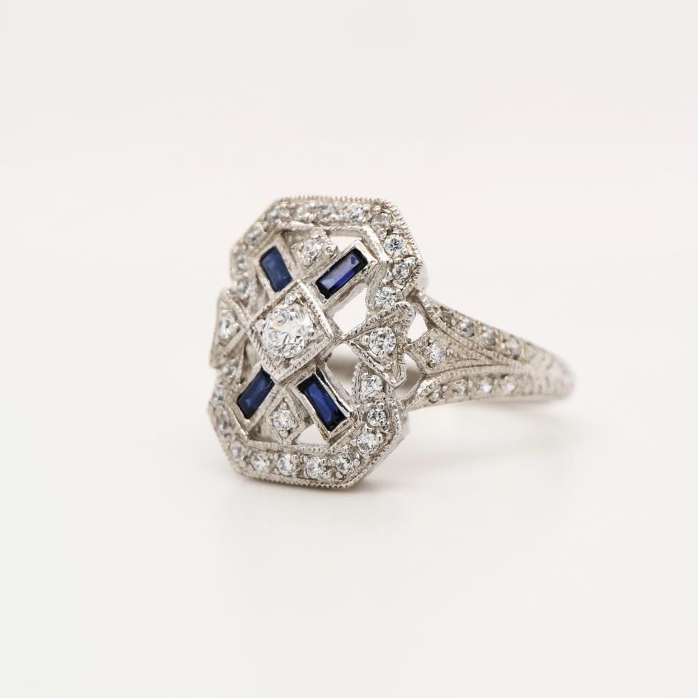 Shield ring with CZ center stone and Halo, with Sapphire Accents in Silver