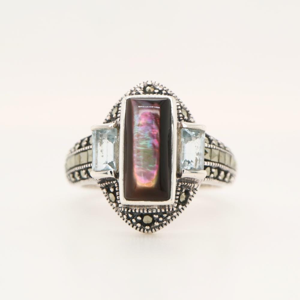 Silver lipped oyster shell and Pale Blue topaz ring with marcasite and Sterling Silver.