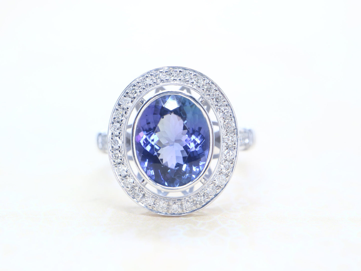 Tanzanite vintage halo ring in 18k white gold, Art deco style diamond ring with tanzanite