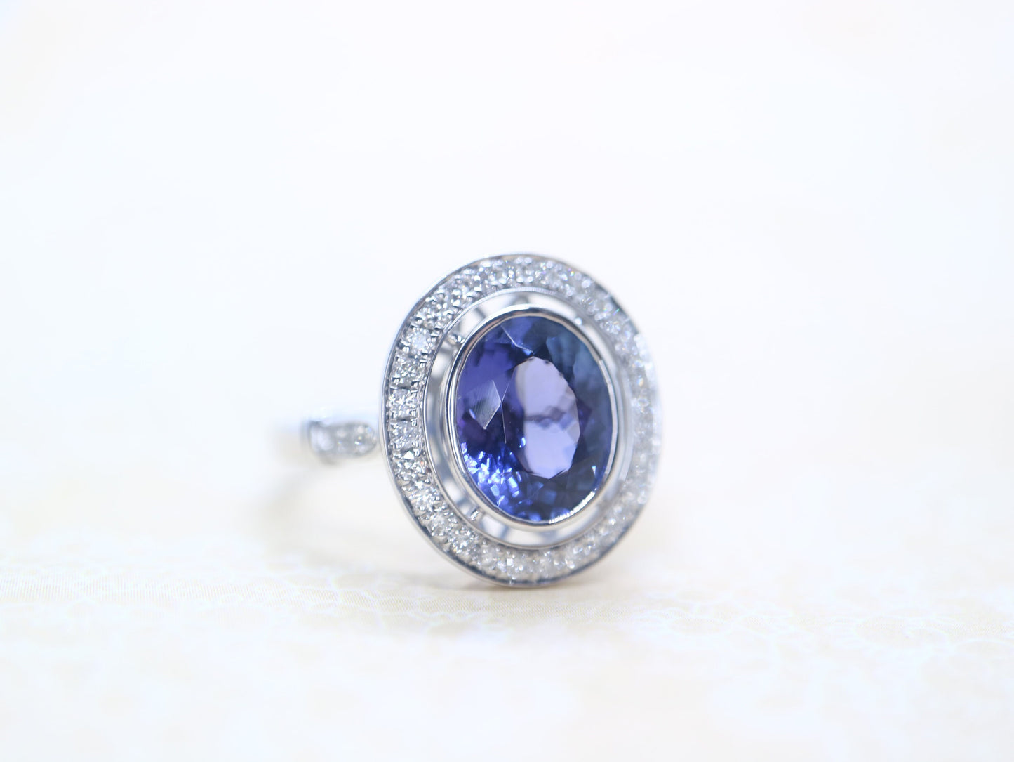 Tanzanite vintage halo ring in 18k white gold, Art deco style diamond ring with tanzanite