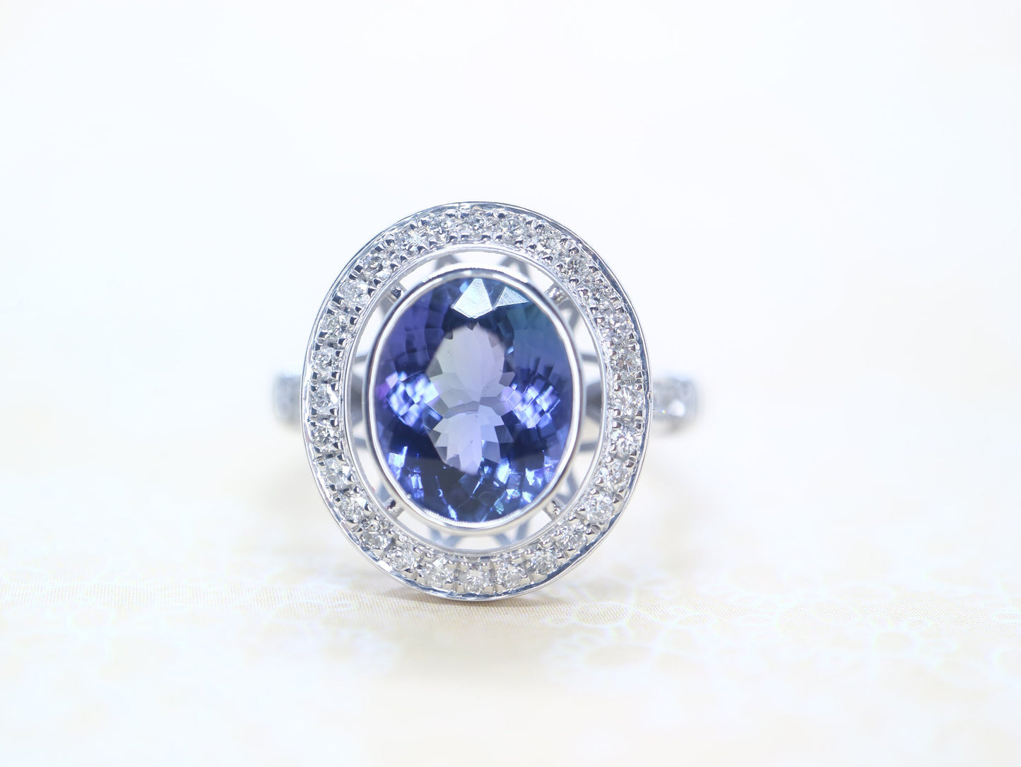 Tanzanite vintage halo ring in 18k white gold, Art deco style diamond ring with tanzanite