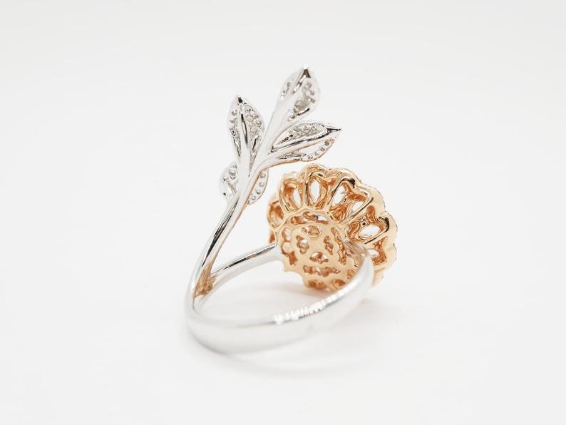 Diamond and sapphire flower ring with diamond leaf and blue sapphire solitaire centre, Rose gold flower ring with rose cut diamonds