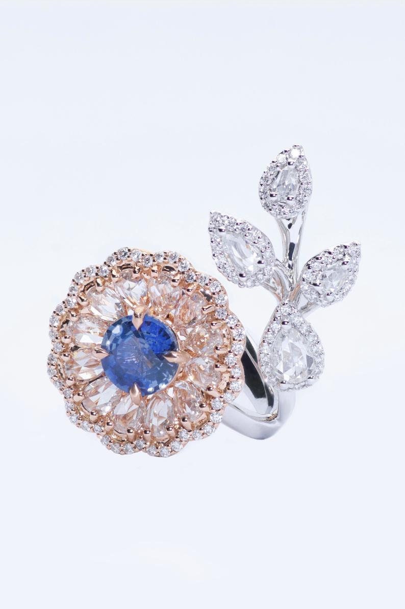 Diamond and sapphire flower ring with diamond leaf and blue sapphire solitaire centre, Rose gold flower ring with rose cut diamonds