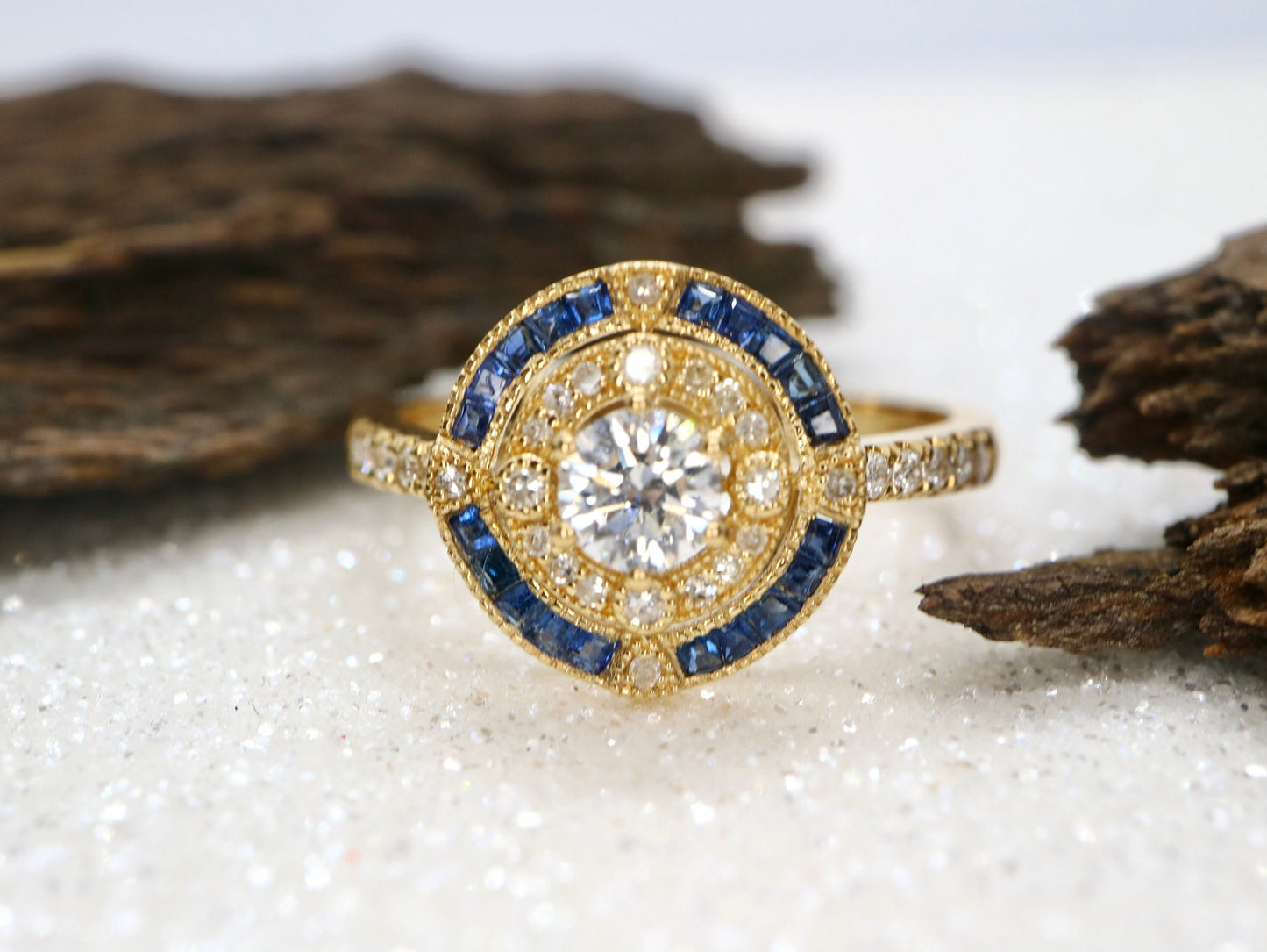 Antique art deco inspired white gold ring with diamond and blue sapphire halo