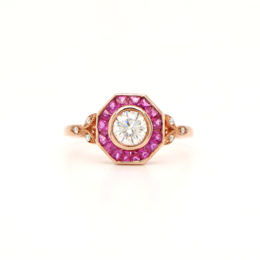 Target ring with Channel set Sapphires and Moissanite in Rose Gold
